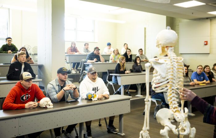 classroom with students and skeleton