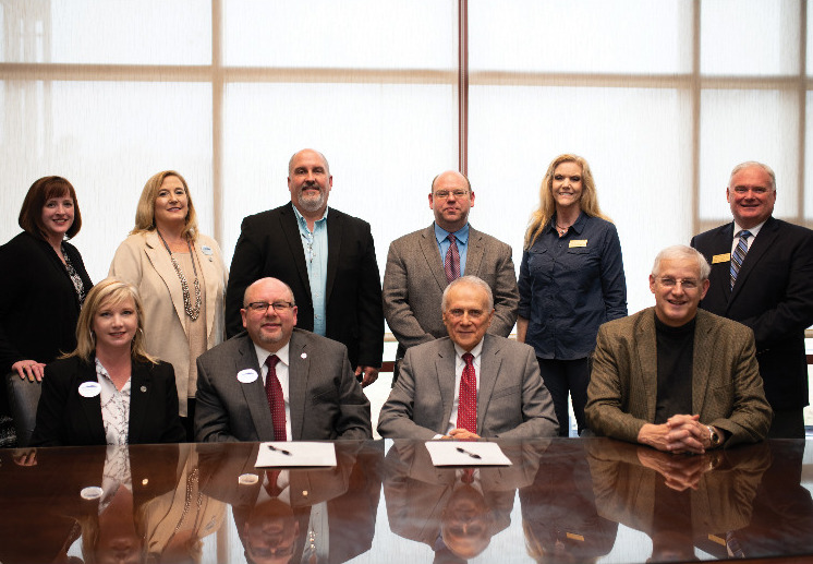 Pictured left to right are: front row, NGTC Vice President of Academic Affairs Mindy Glander, NGTC President Dr. Mark Ivester, Emmanuel College President Dr. Ron White, Emmanuel College Vice President of Academic Affairs Dr. John Henzel. Back row, NGTC Dean of Academic Affairs General Education Michelle Likins, NGTC Dean of Academic Affairs Healthcare Christy Bivins, NGTC Agriculture Program Director Wayne Randall, Emmanuel College Dean of School of Business Dr. David Jordan, Emmanuel College Dean of Social Sciences/Chair of Criminal Justice Department Dr. Sue Weaver, and Emmanuel College Agriculture Program Chair Owen Thomason.