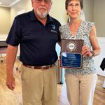 11Pictured (left to right): NGTC Board of Directors chair Mitchel Barrett presents Board of Directors member Jane Brackett with a commemorative plaque recognizing her 10 years of service.