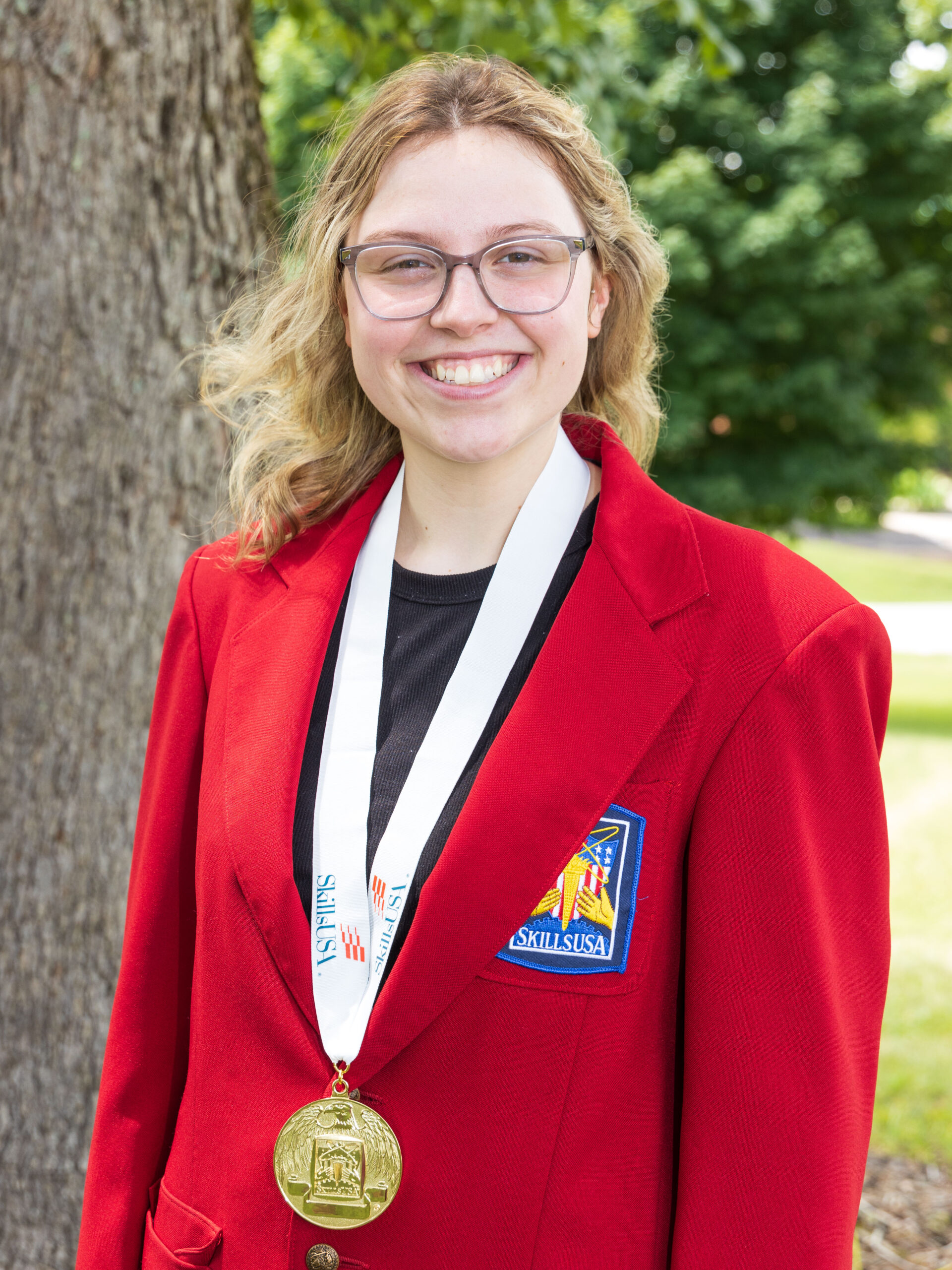 Pictured: Culinary Arts student Hannah Nelson with national SkillsUSA gold medal. 