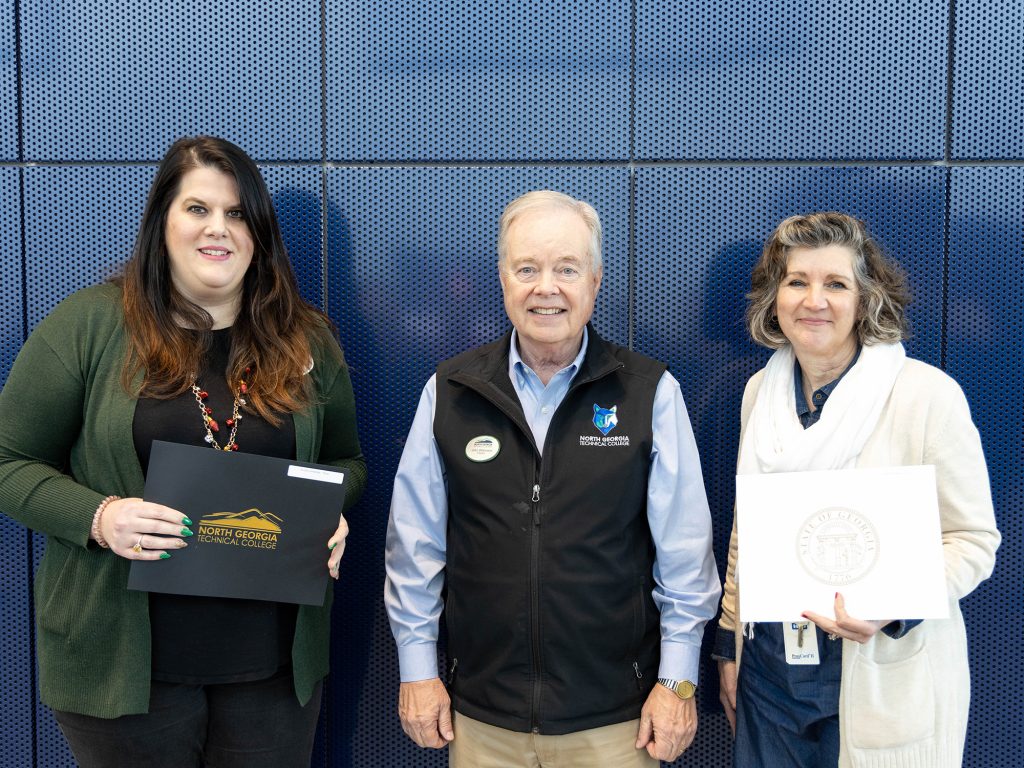 10-year Service Awards (L to R): Audra Jimenez; NGTC President John Wilkinson; Heidi Tapley; (not pictured) Charles Hill; and Dr. Michele Shirley 