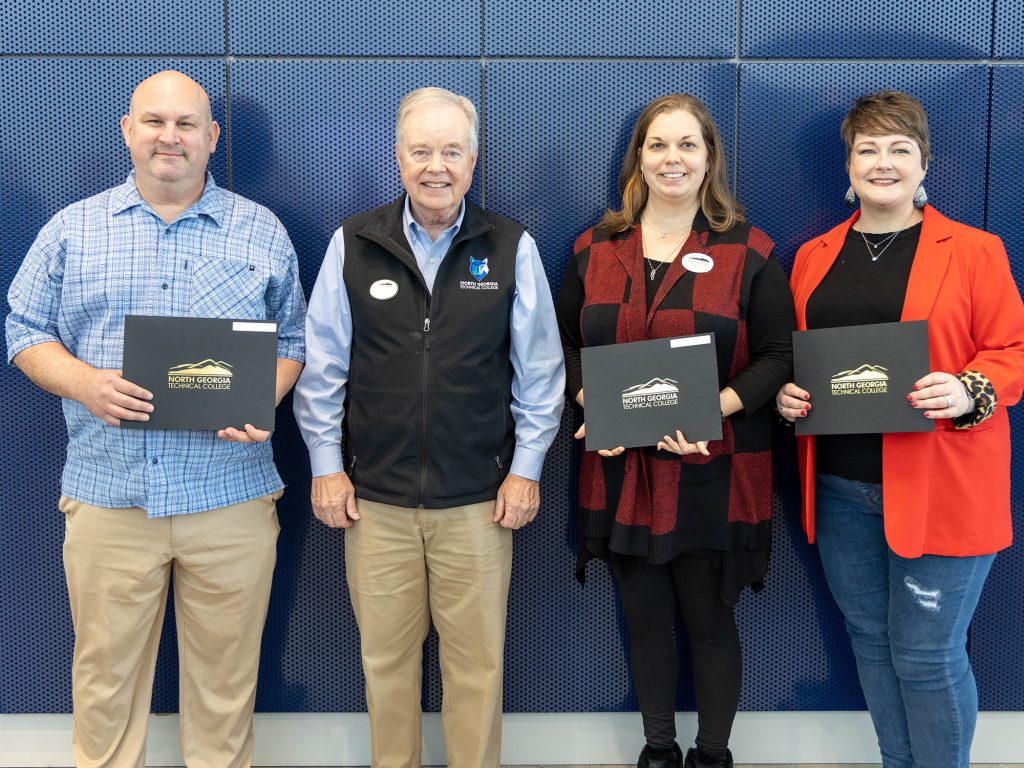 15-year Service Awards (L to R): Chris Bladowski; NGTC President John Wilkinson; Stacie Bohannon; Leslie McFarlin; and (not pictured) Chris Haley 